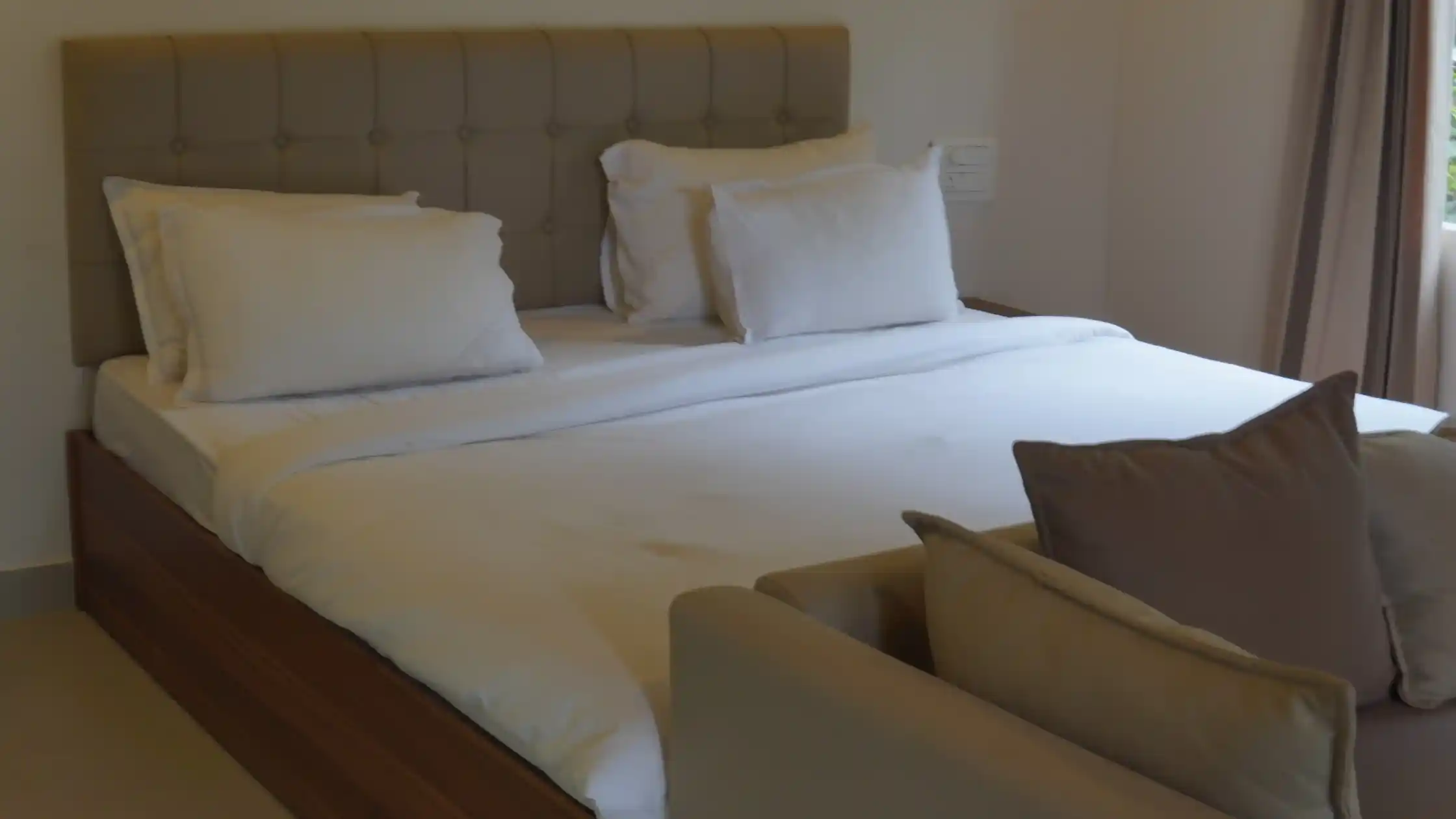 Elegant bedroom accommodation for a wedding party in Sakleshpur resort.