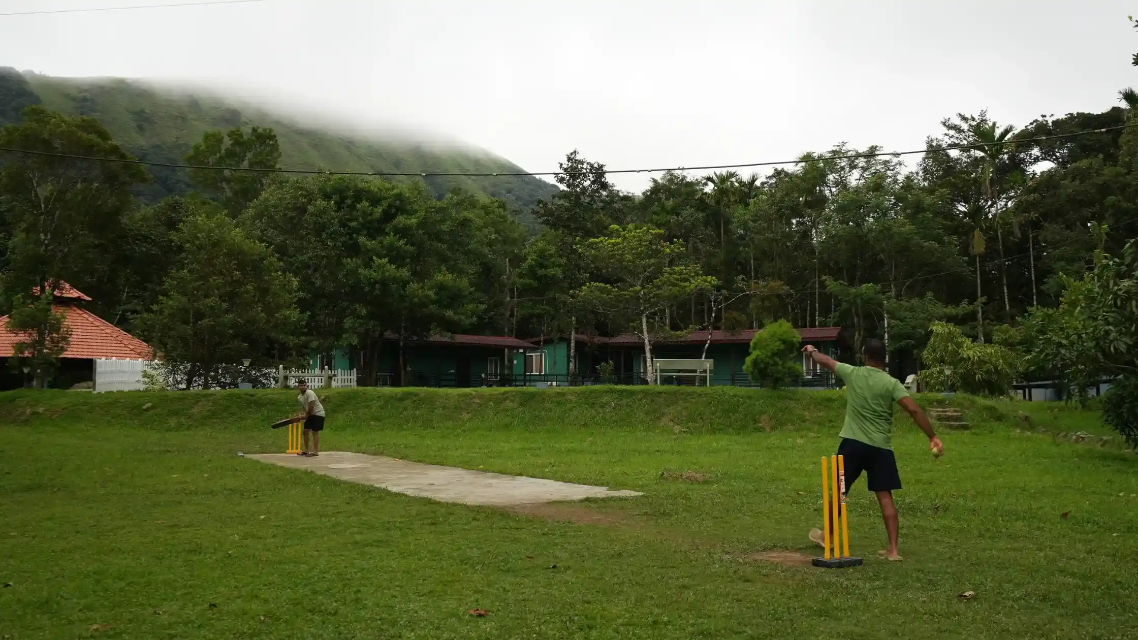 Themes and Activities: Guests playing cricket at a Sakleshpur resort.